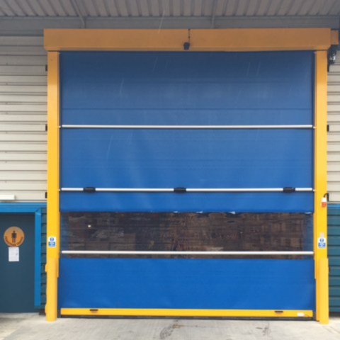 Blue high speed door installed with a yellow surround